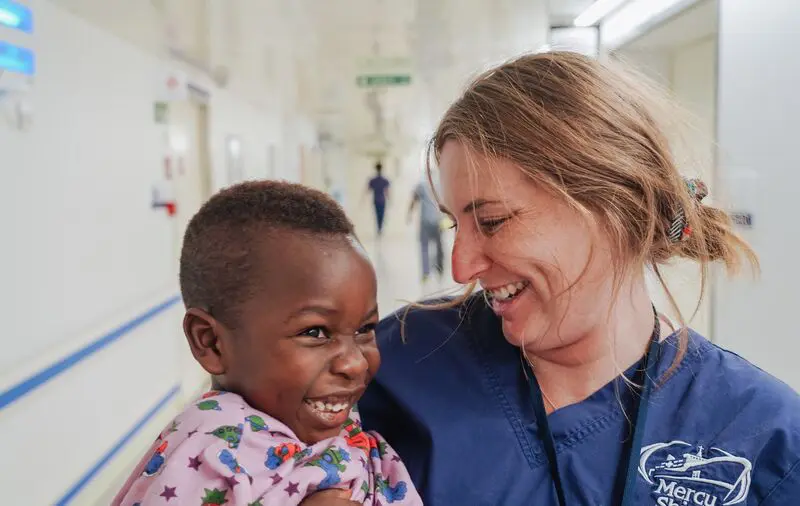 Ayla Lopez, Ward Nurse (Paediatric ICU), with a patient.