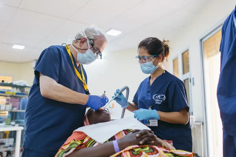 April Manalang-Pressler, Dental Assistant, working at the Dental Clinic alongside Dentist, Luer Koeper.