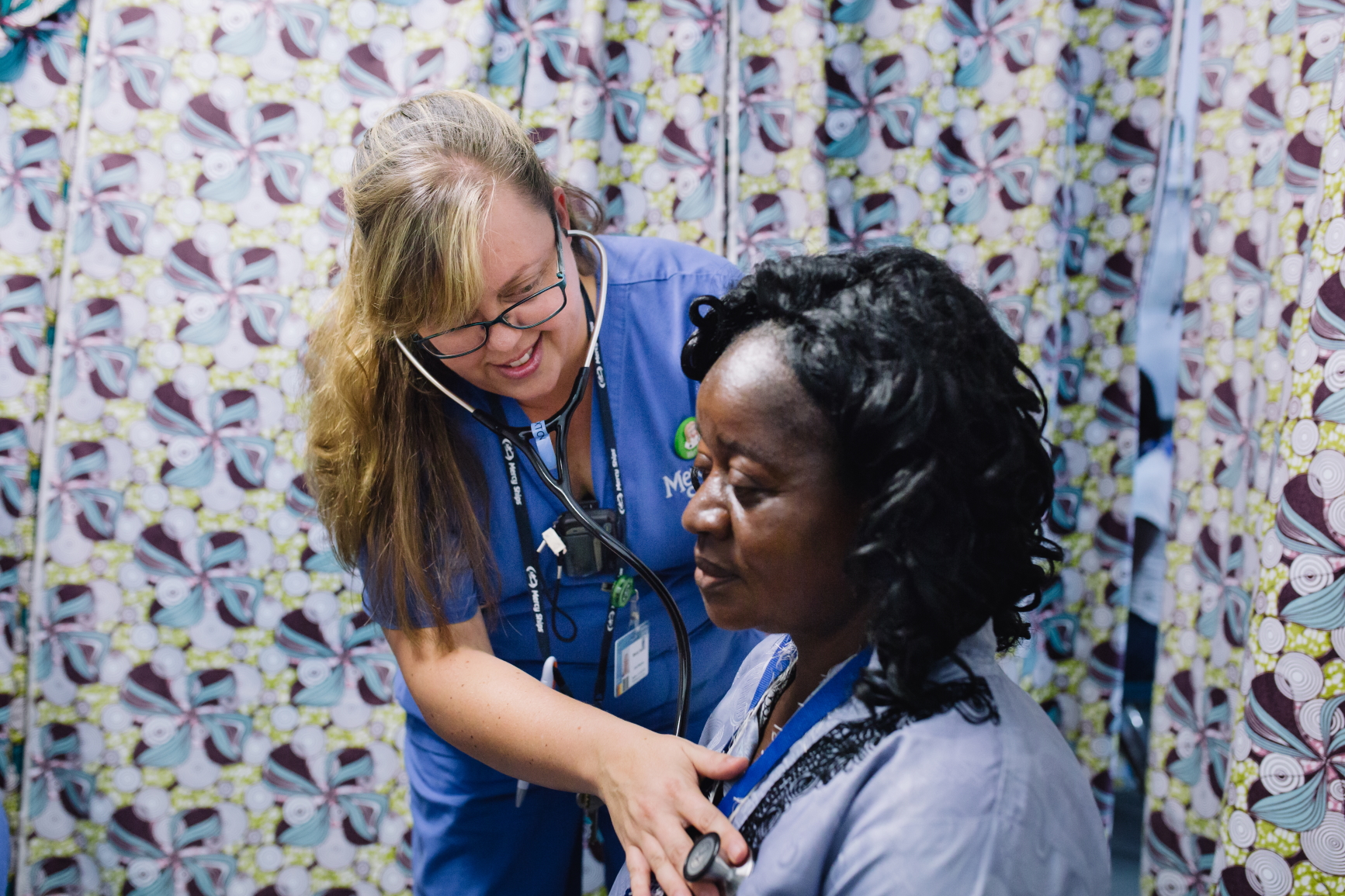 Wendy Sexton, Crew Physician, examining a patient in Admissions.