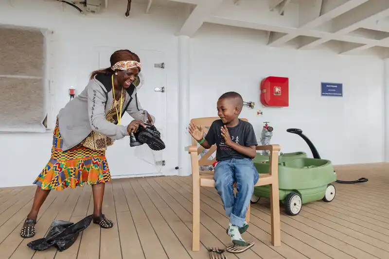 Abubakarr's, plastics patient, reaction to being gifted his first ever pair of shoes.