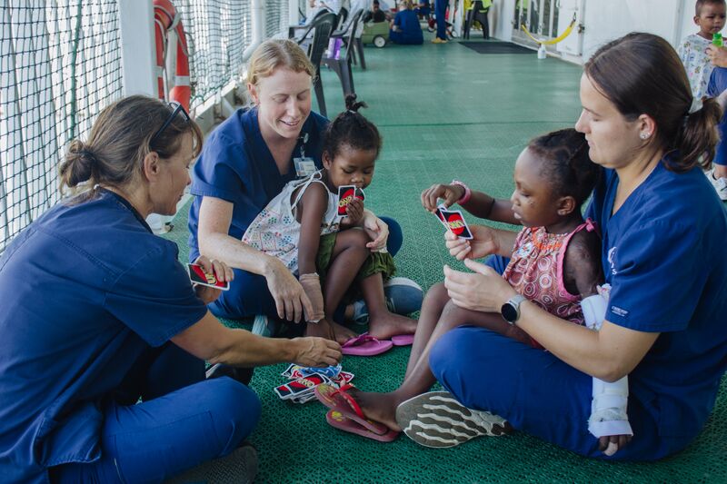 Lisa Bargh, Jenna Cooper, and KJ Rackley, Ward Nurses, playing with Victoria, plastics patient, and other patients at deck7.