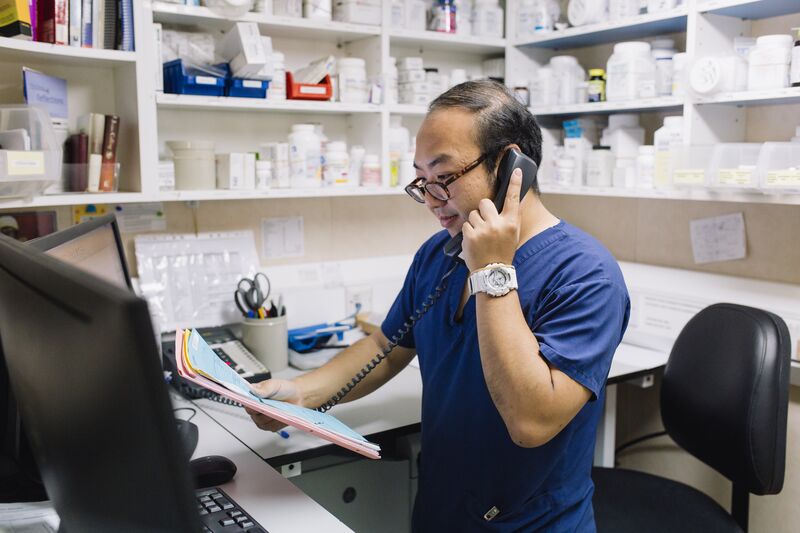 Vincent Lo, Pharmacist, working in the Pharmacy.