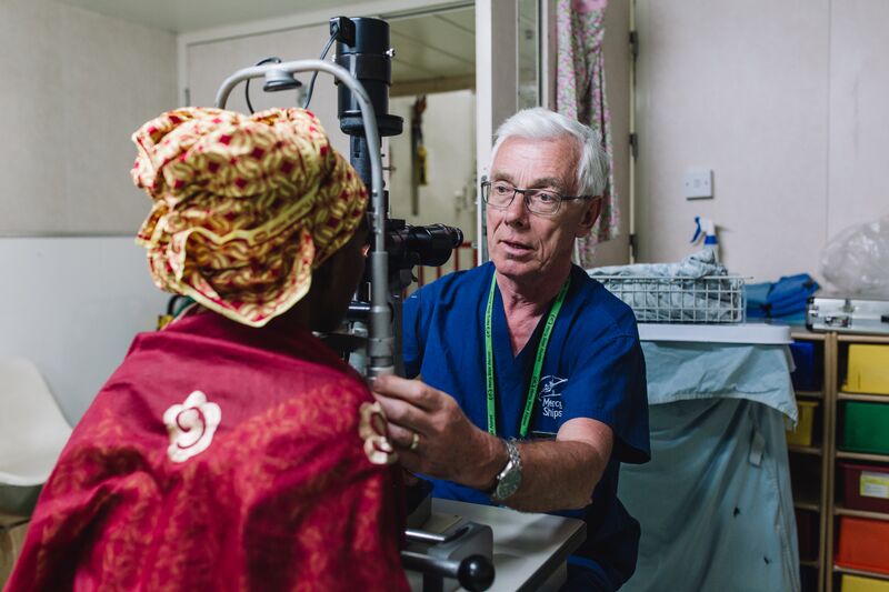 Jørgen Nissen, Ophthalmic Senior Clinician, examining a cataract patient before surgery.