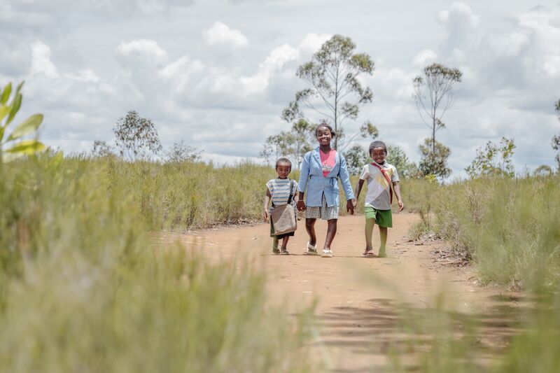 Fenitra, Rolland, and Rody, sibling orthopaedics patients, at their home during a home visit.