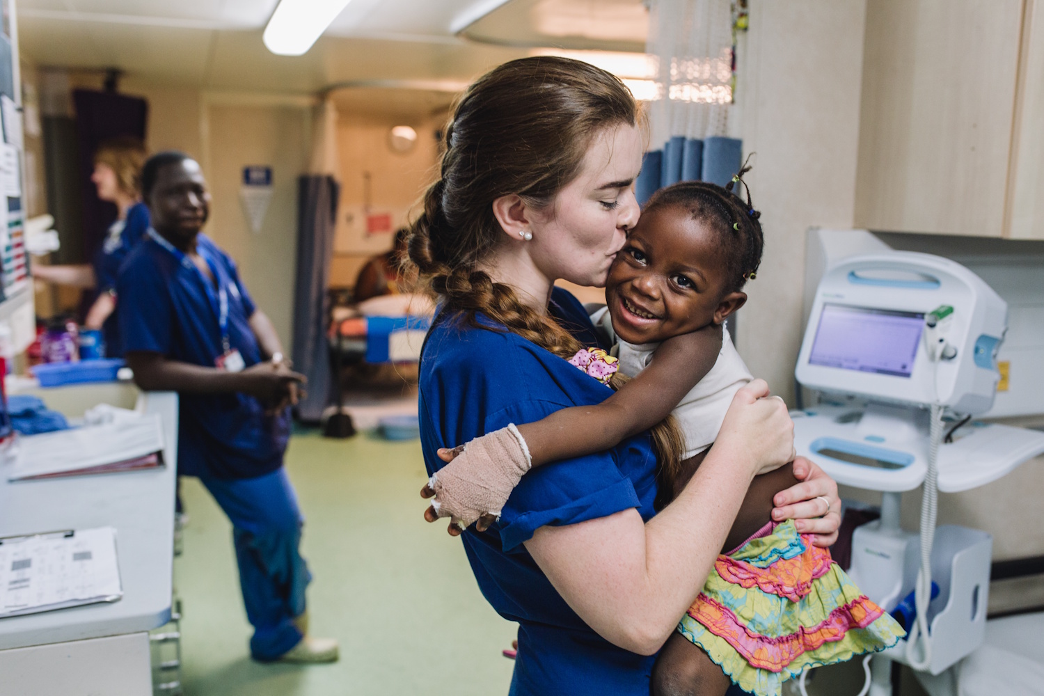 Wendy Sexton, Crew Physician, examining a patient in Admissions.