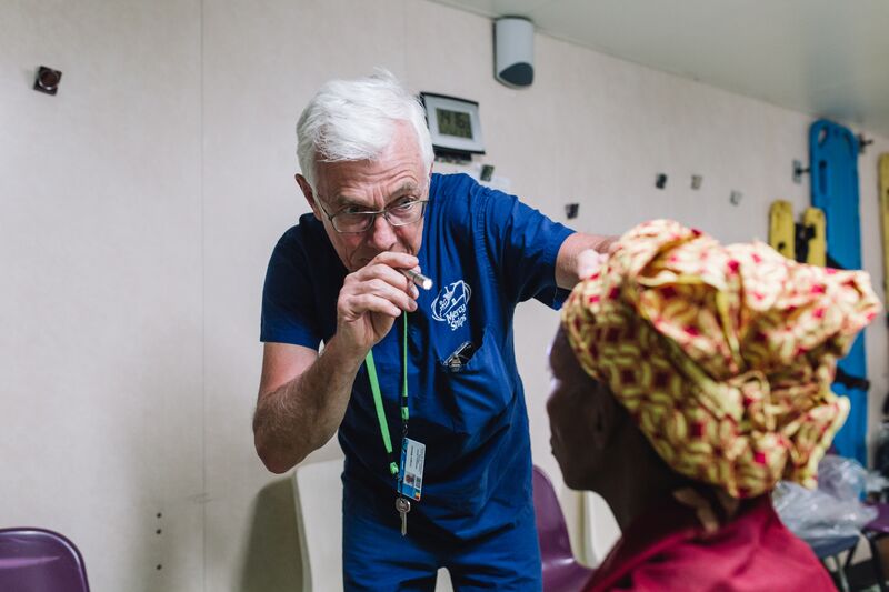 Jørgen Nissen, Ophthalmic Senior Clinician, examining a cataract patient before surgery.
