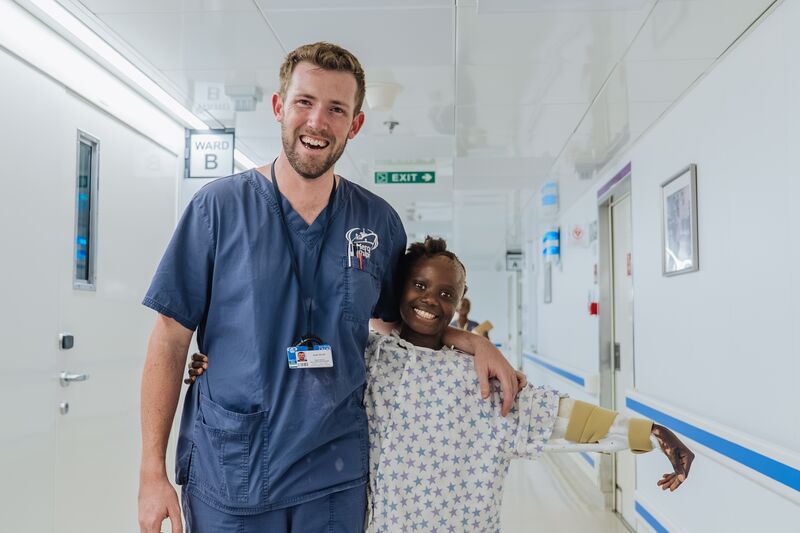 osh Scott, Ward Nurse Reconstructive Plastic Team Leader, with Jaminatu, plastics patient.