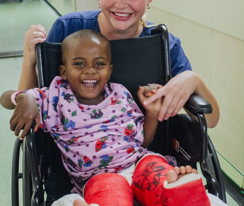 Hannah Bryant, Ward Nurse, with a patient.